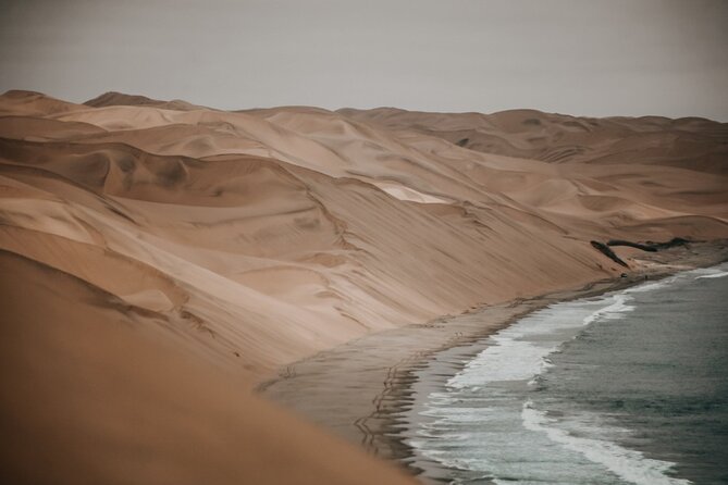 Sandwich Harbour 4x4 Guided Tour - Unforgettable Adventure - Stop 3: Namib-Naukluft Park coast driving and the dune-ocean transition