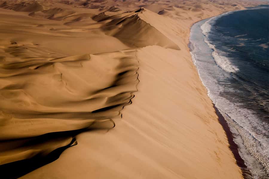 Walvis Bay and Sandwich Harbour Tour - Entering Namib-Naukluft National Park and the dunes that hit the Atlantic