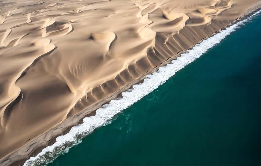 Namib dunes falling straight into the Atlantic surf south of Walvis Bay